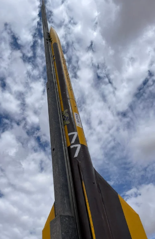 Close-up view of the rocket during launch against cloudy sky